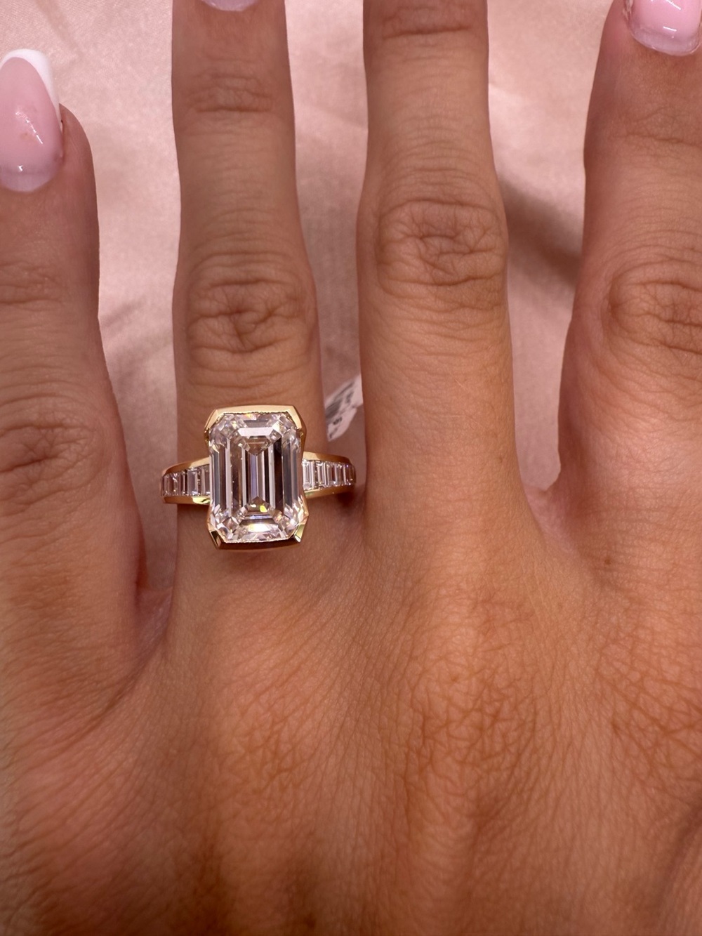 5.03 carat E VS1 emerald cut half bezel lab diamond with graduated channel set